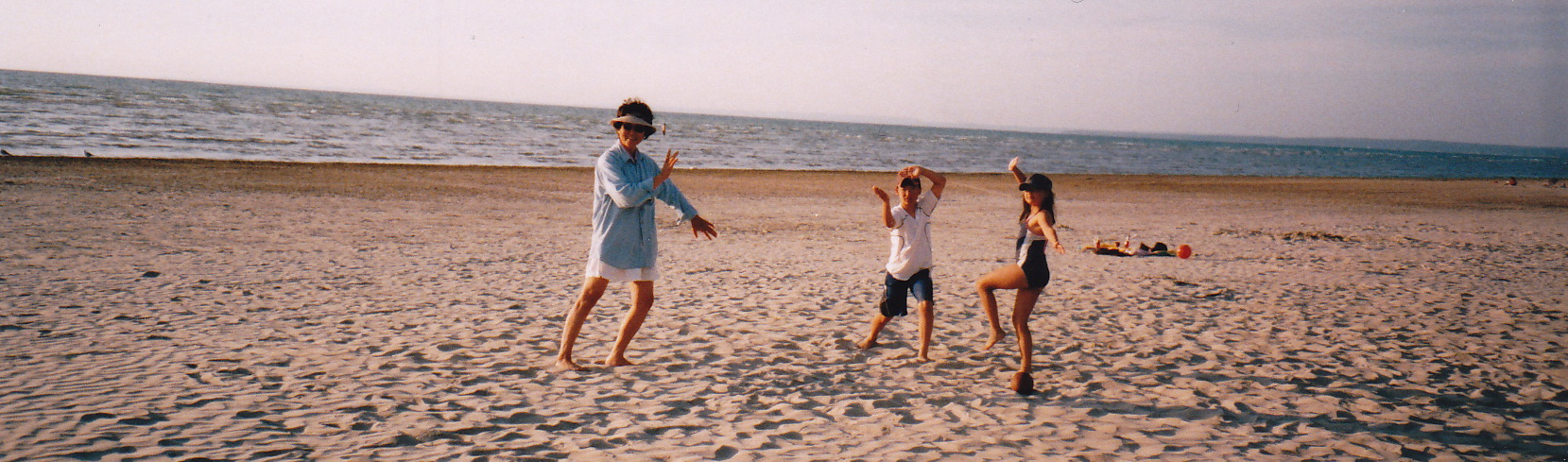 picture of people doing TaiChi on the beach